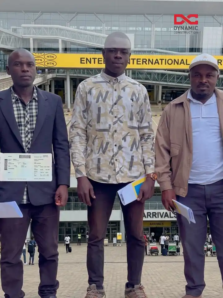 Workers with travel documents at international airport